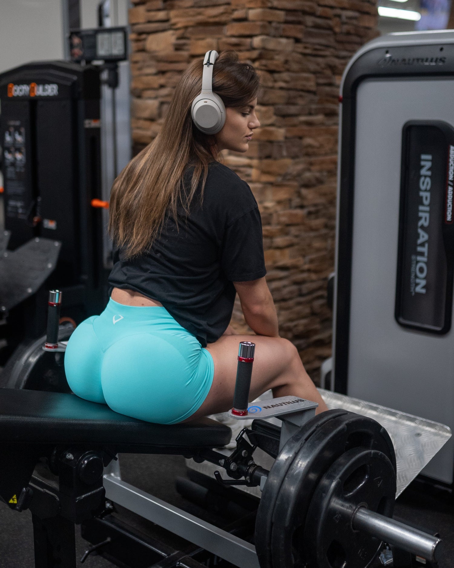 woman training glutes in seamless violate shorts