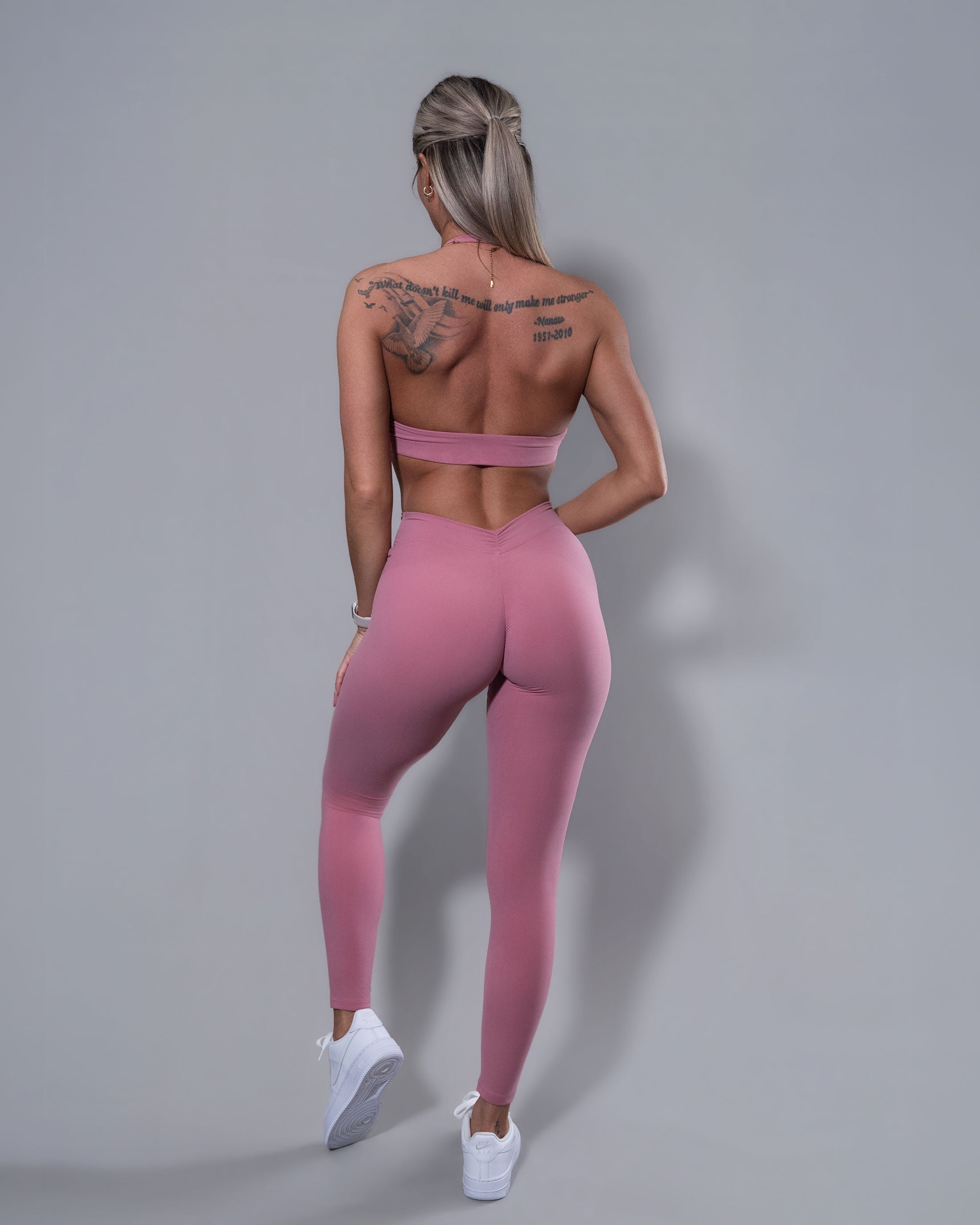 Allure V-Back Leggings in blush paired with halter top, back view showing glute-lifting