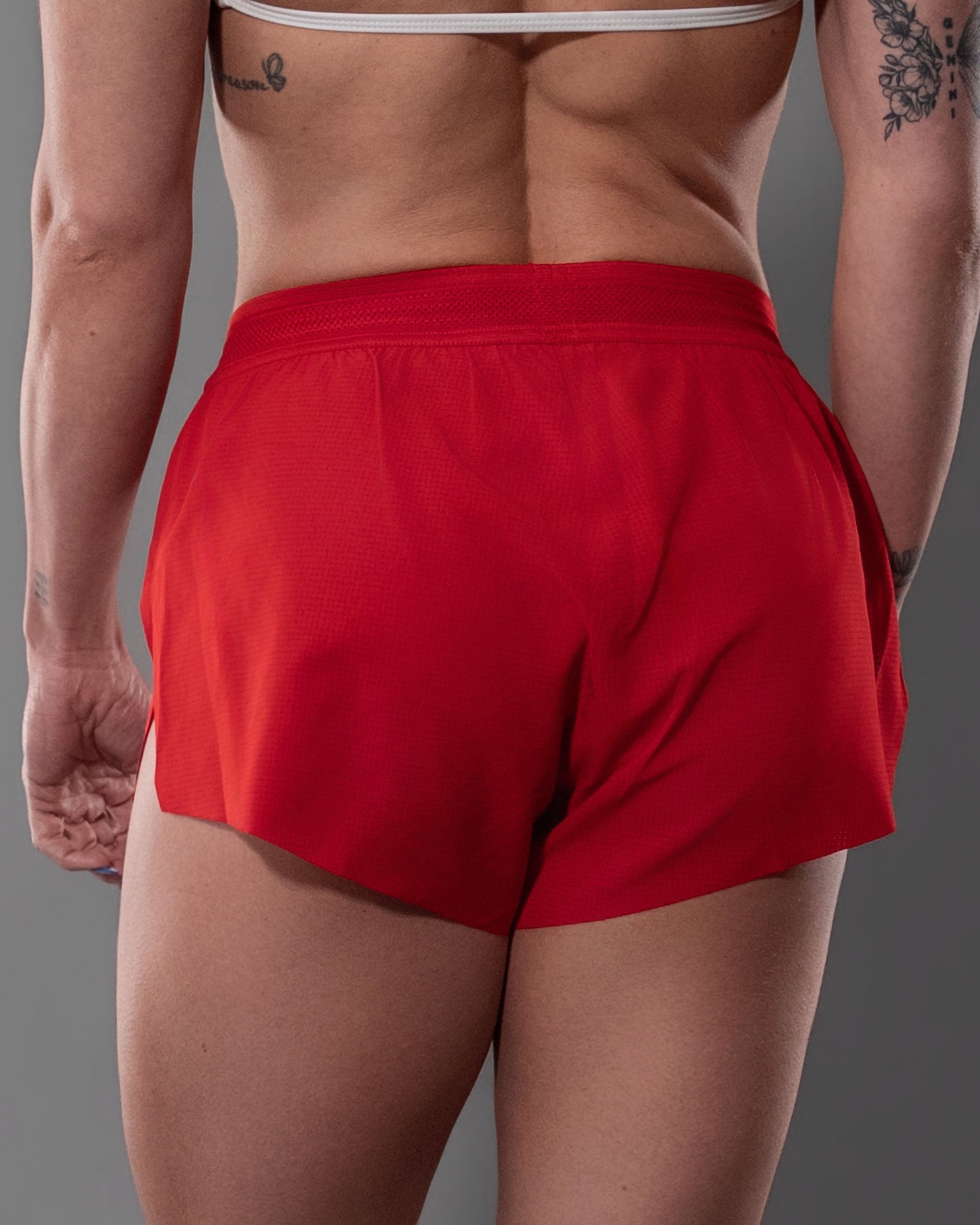 Close-up of the textured micro mesh fabric on red Gym Crush Shorts