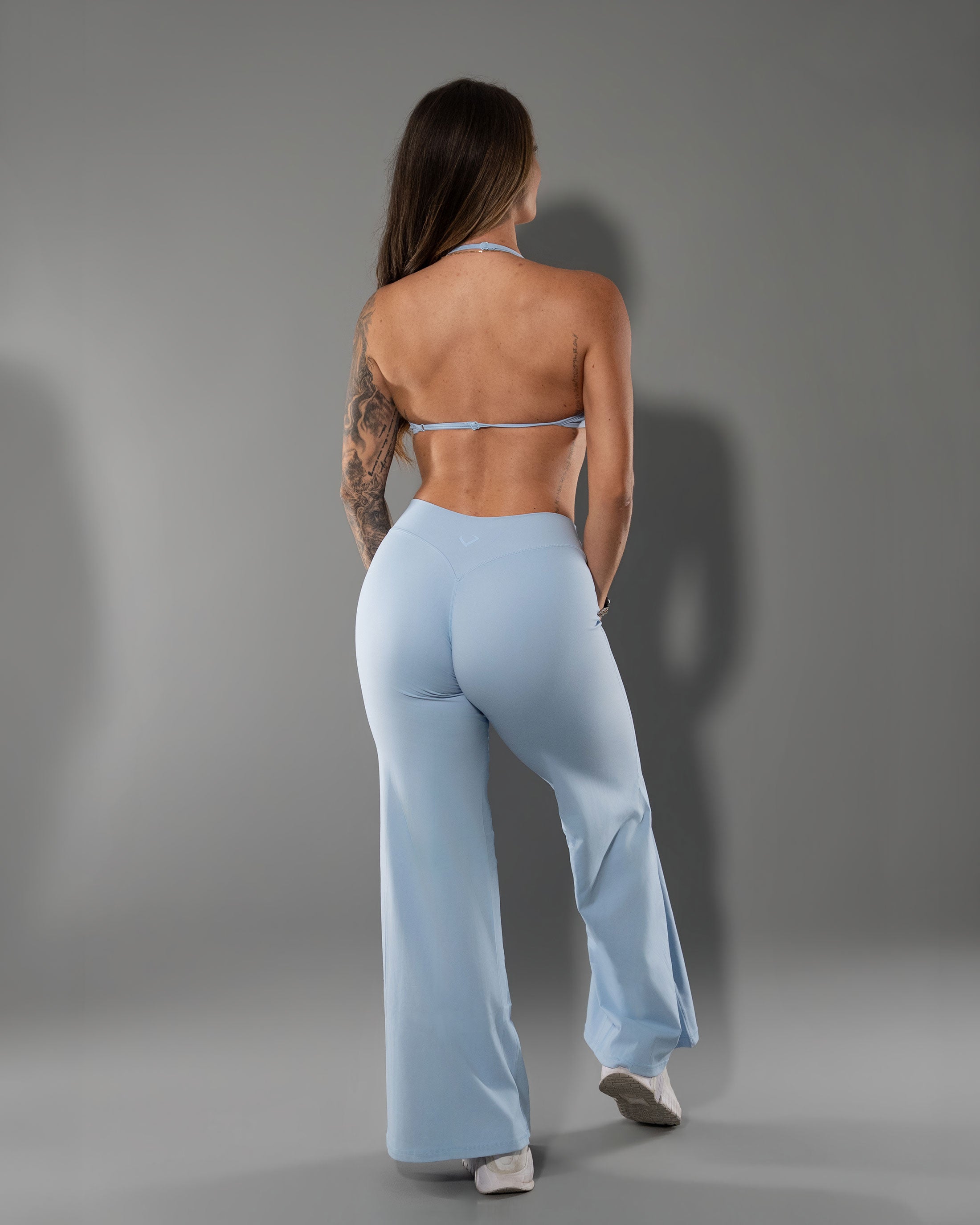 Sky Blue Tempt Halter worn with the matching Tempt Flares, back view