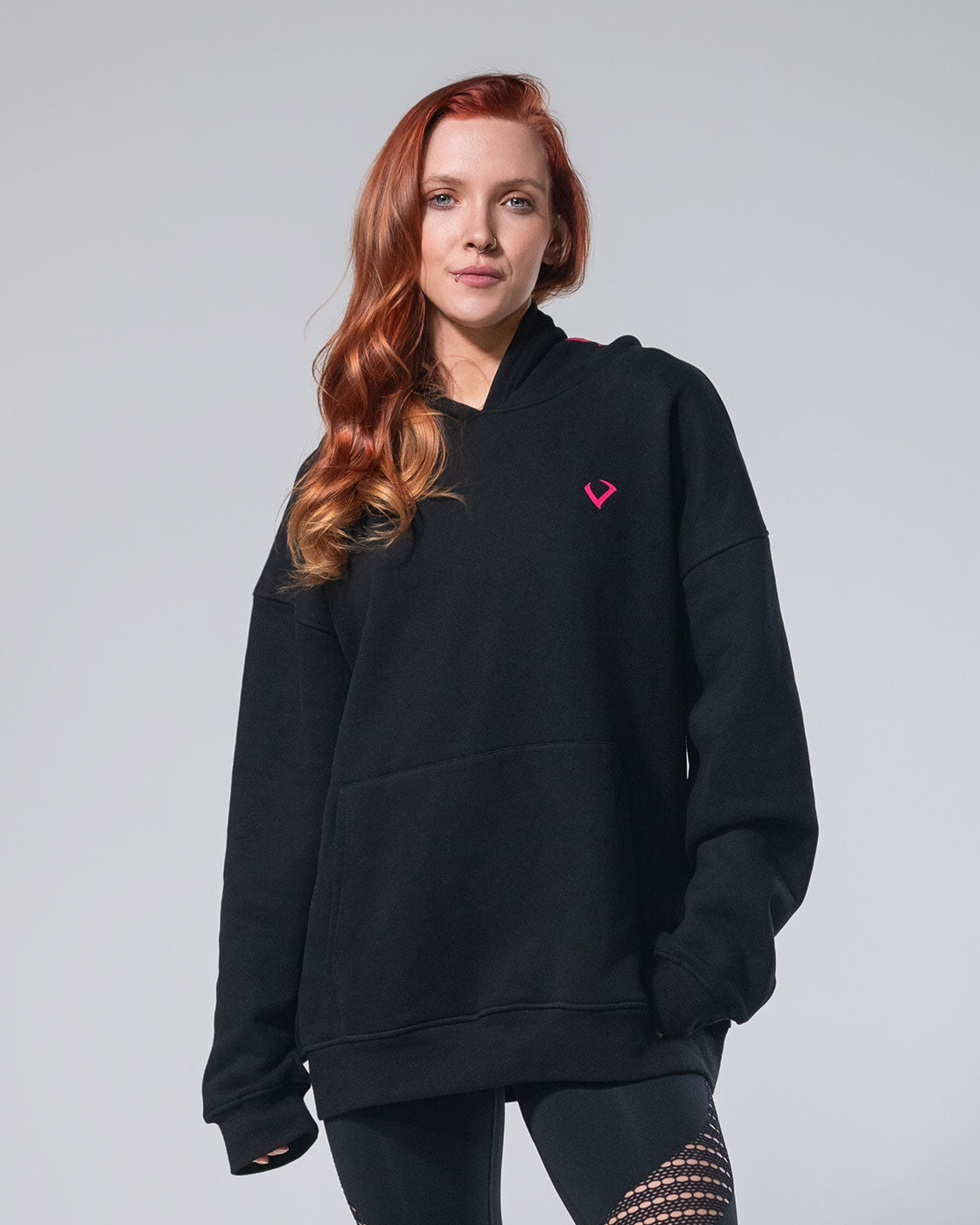 Photo of the Royalty Skull Hoodie in black with pink print.