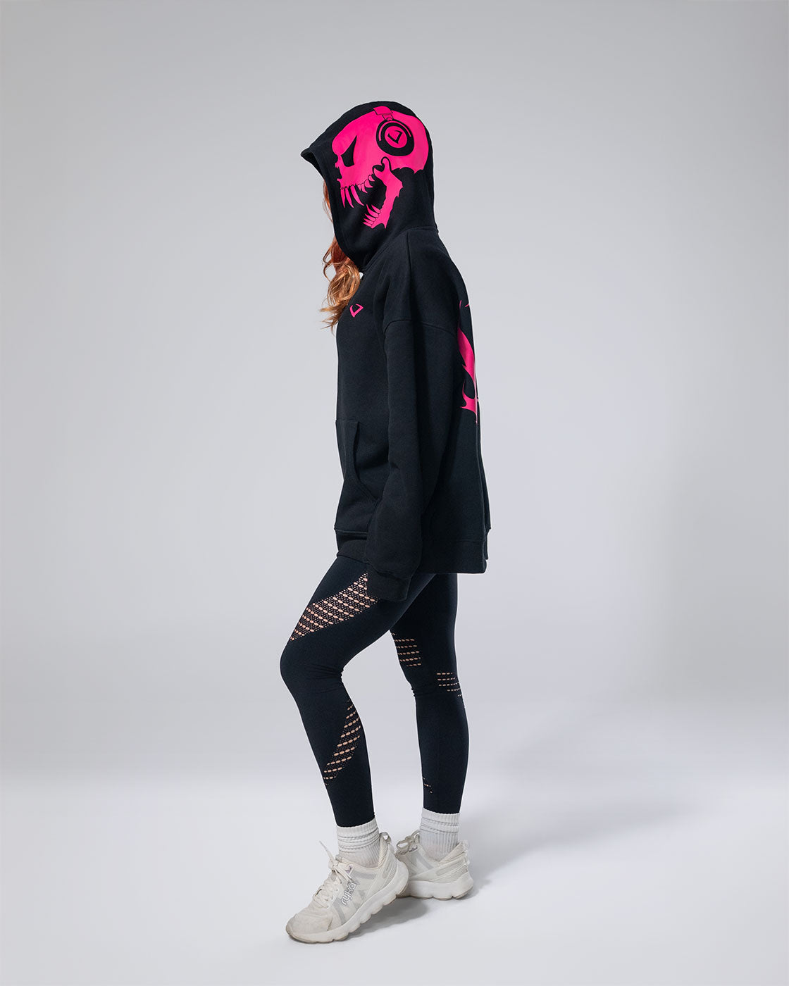 Photo of a girl wearing the Black Royalty Skull Hoodie.