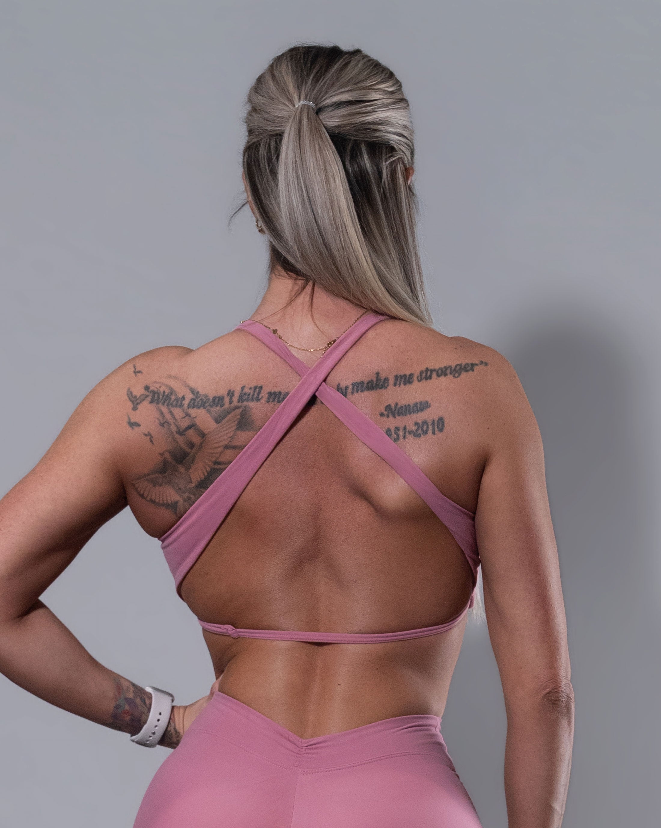 Allure Crossfire Sports Bra in blush, back view of cross-back straps