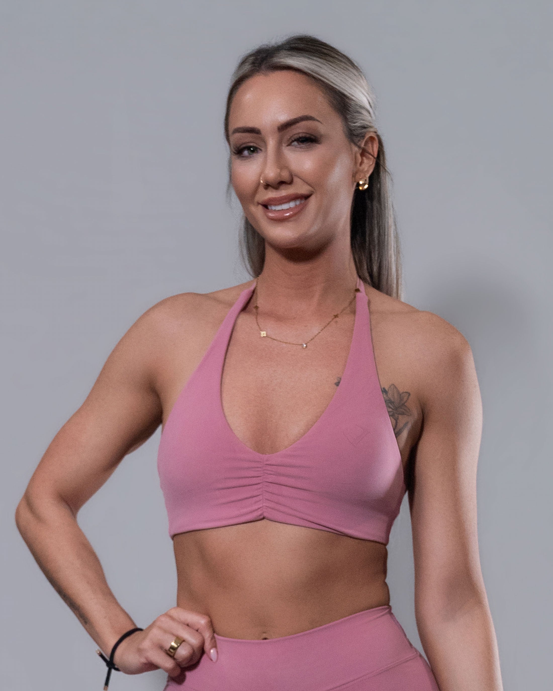 Allure Halter Sports Bra in blush, front view with scrunch detail
