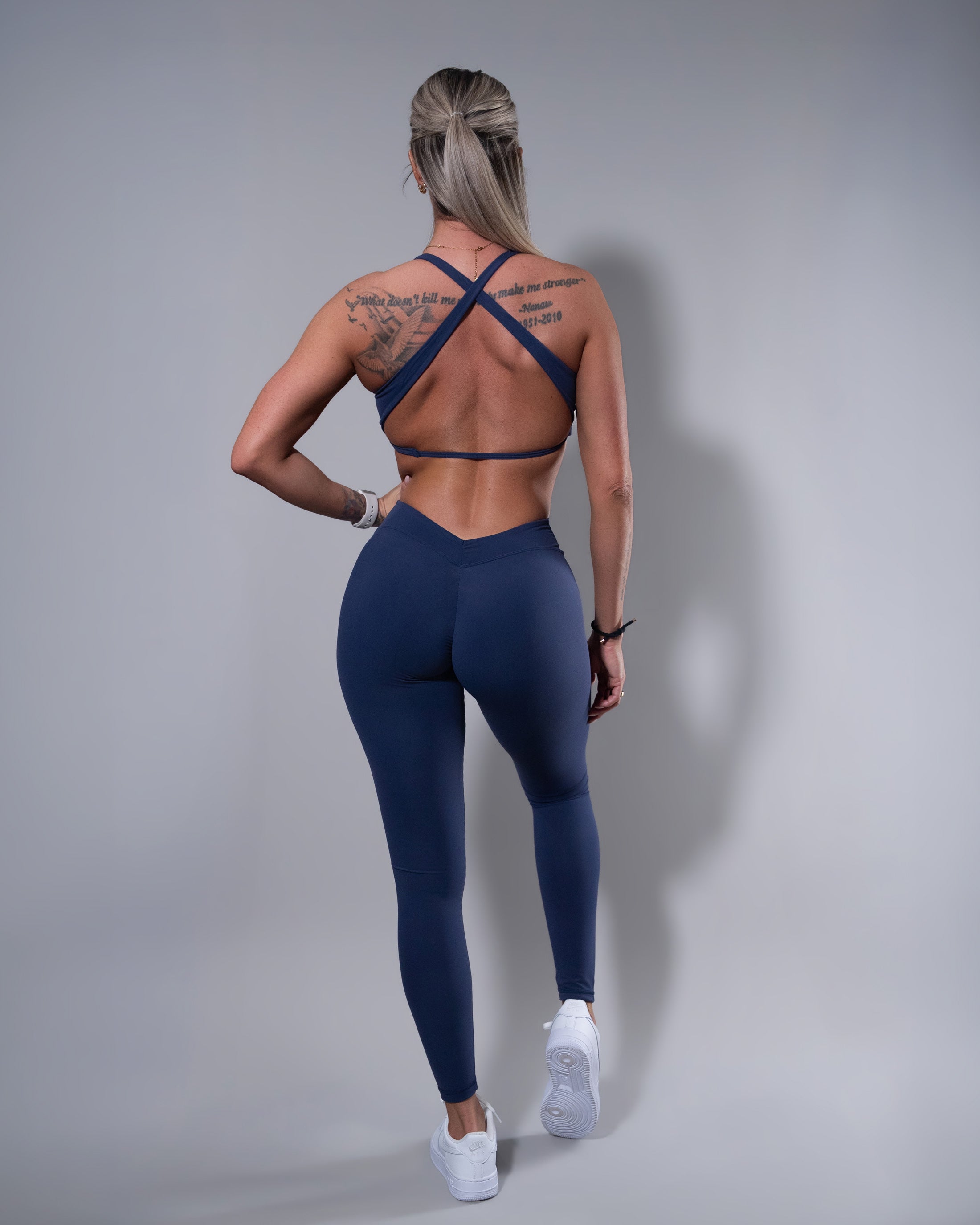 Allure Crossfire Sports Bra and V-Back Leggings set in navy, back view