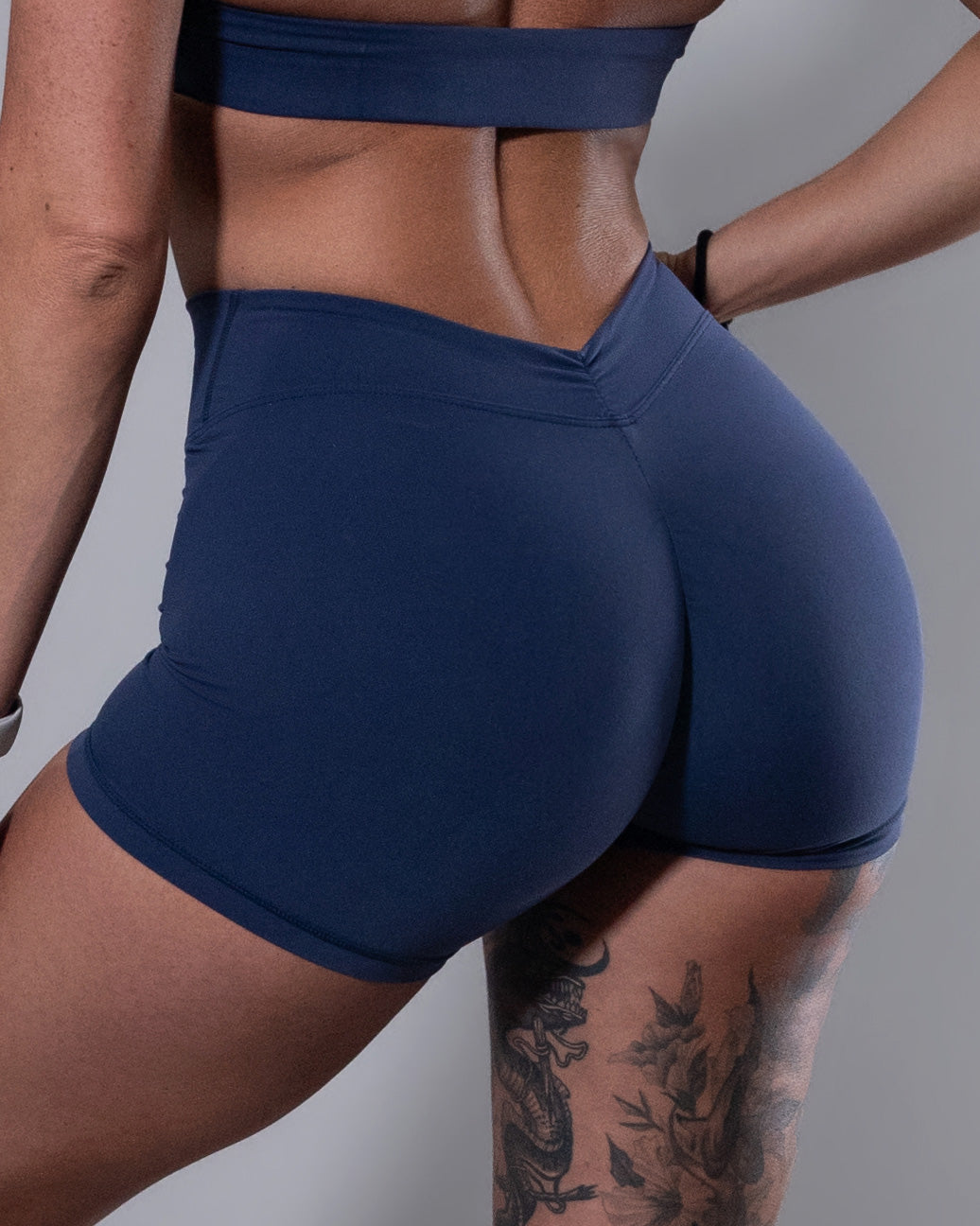 Allure V-Back Shorts in navy, side view of high-waisted compression detail