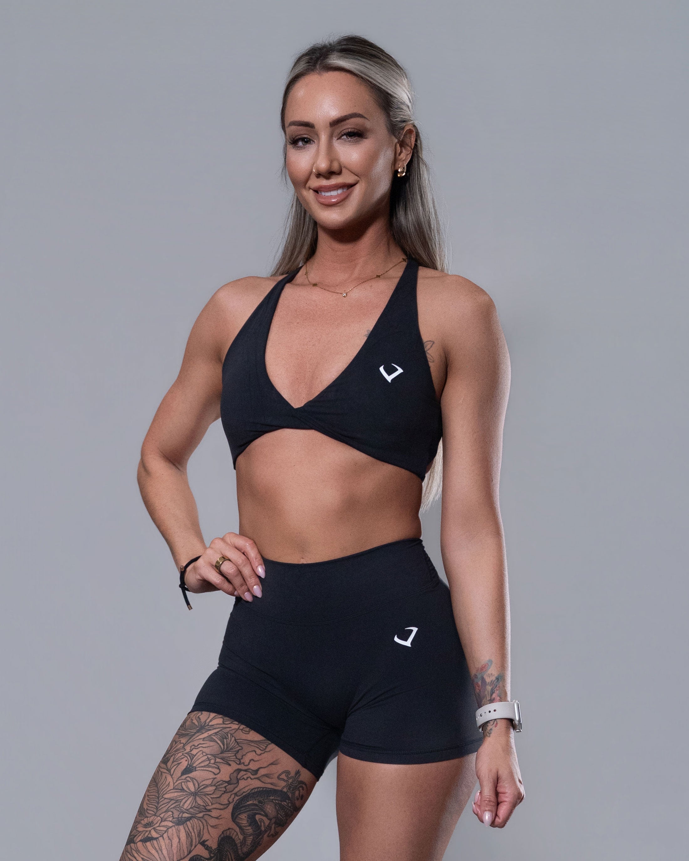 Allure Crossfire Sports Bra and V-Back Shorts set in black, front view