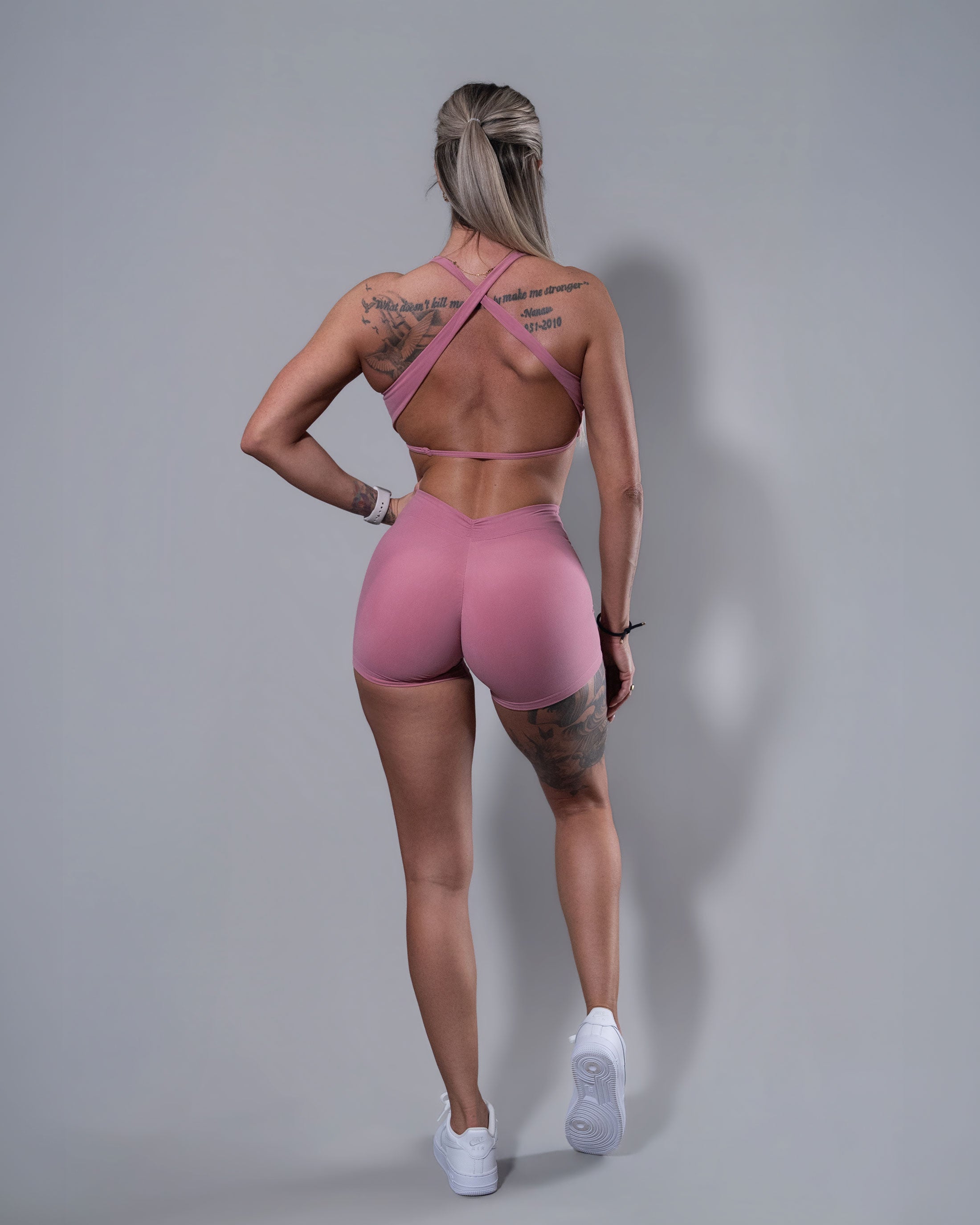 Allure Crossfire Sports Bra and V-Back Shorts set in blush, back view