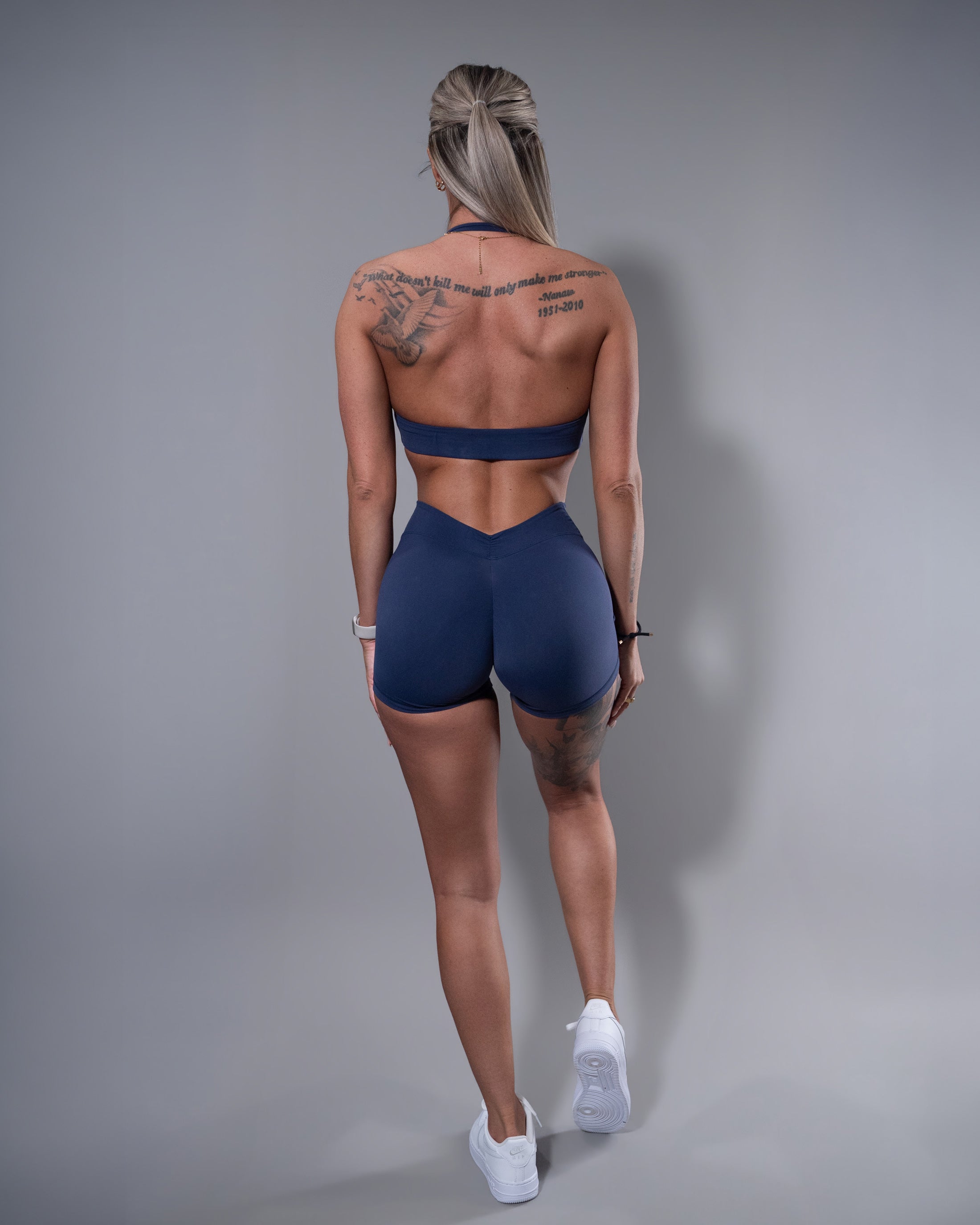 Allure V-Back Shorts and halter sports bra set in navy, back view