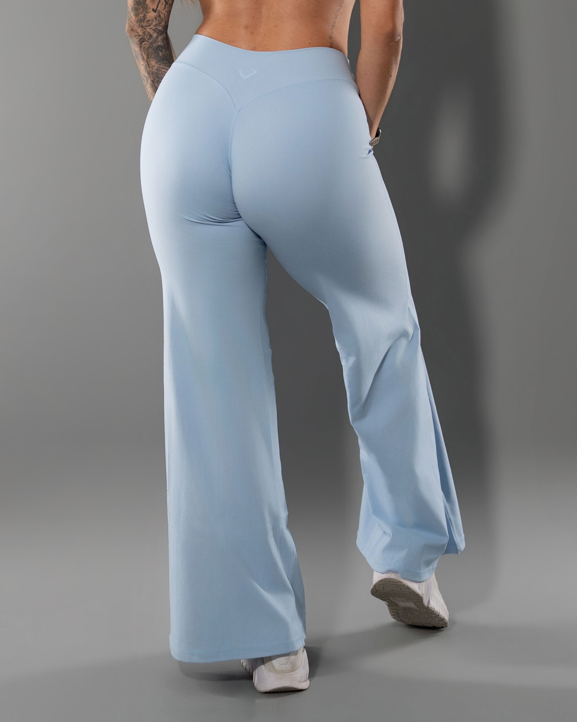 Back view of the Tempt Flares in Sky Blue showing the sculpted waistband and flare leg