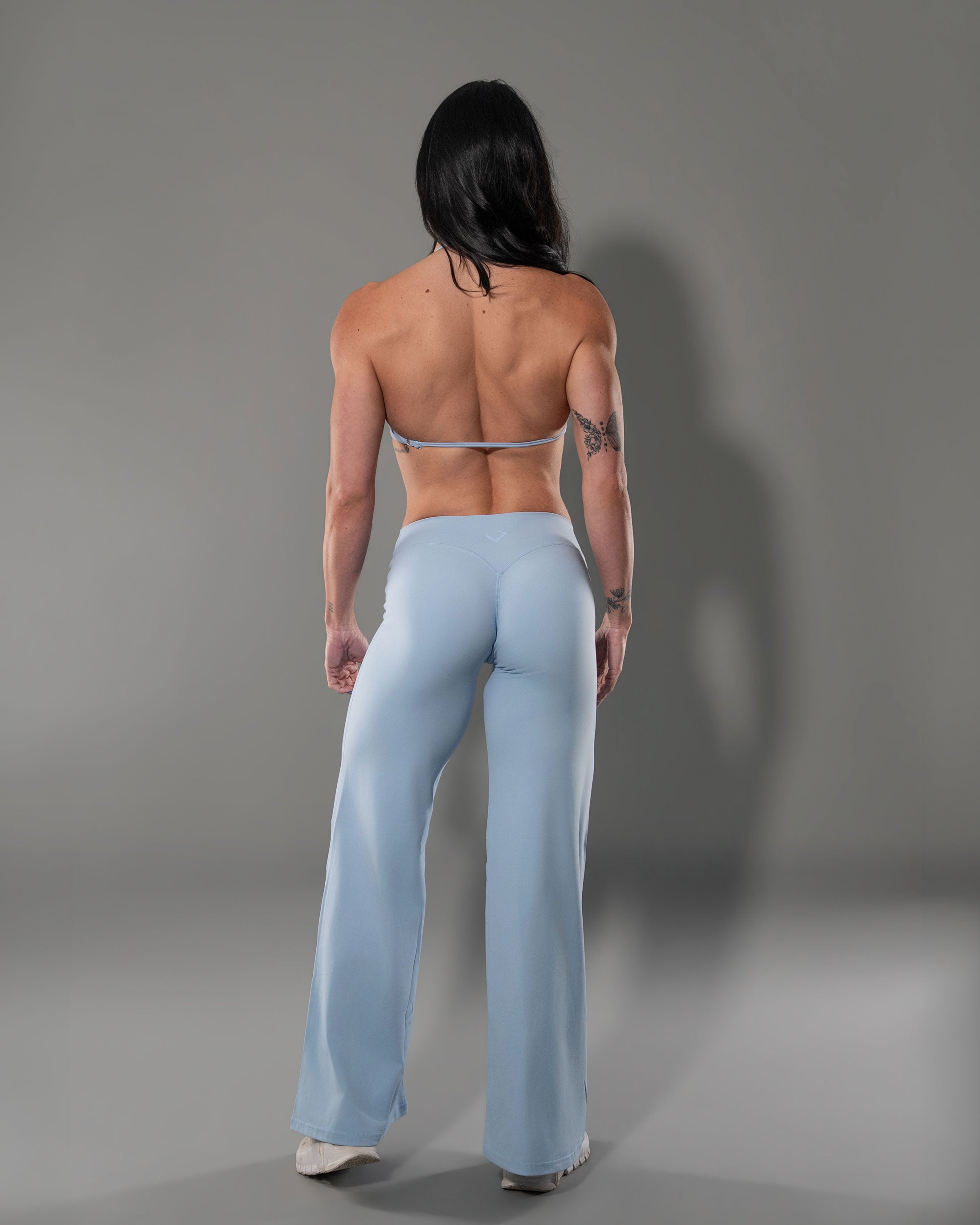 Sky Blue Tempt set from behind, halter top with sculpting flare leggings
