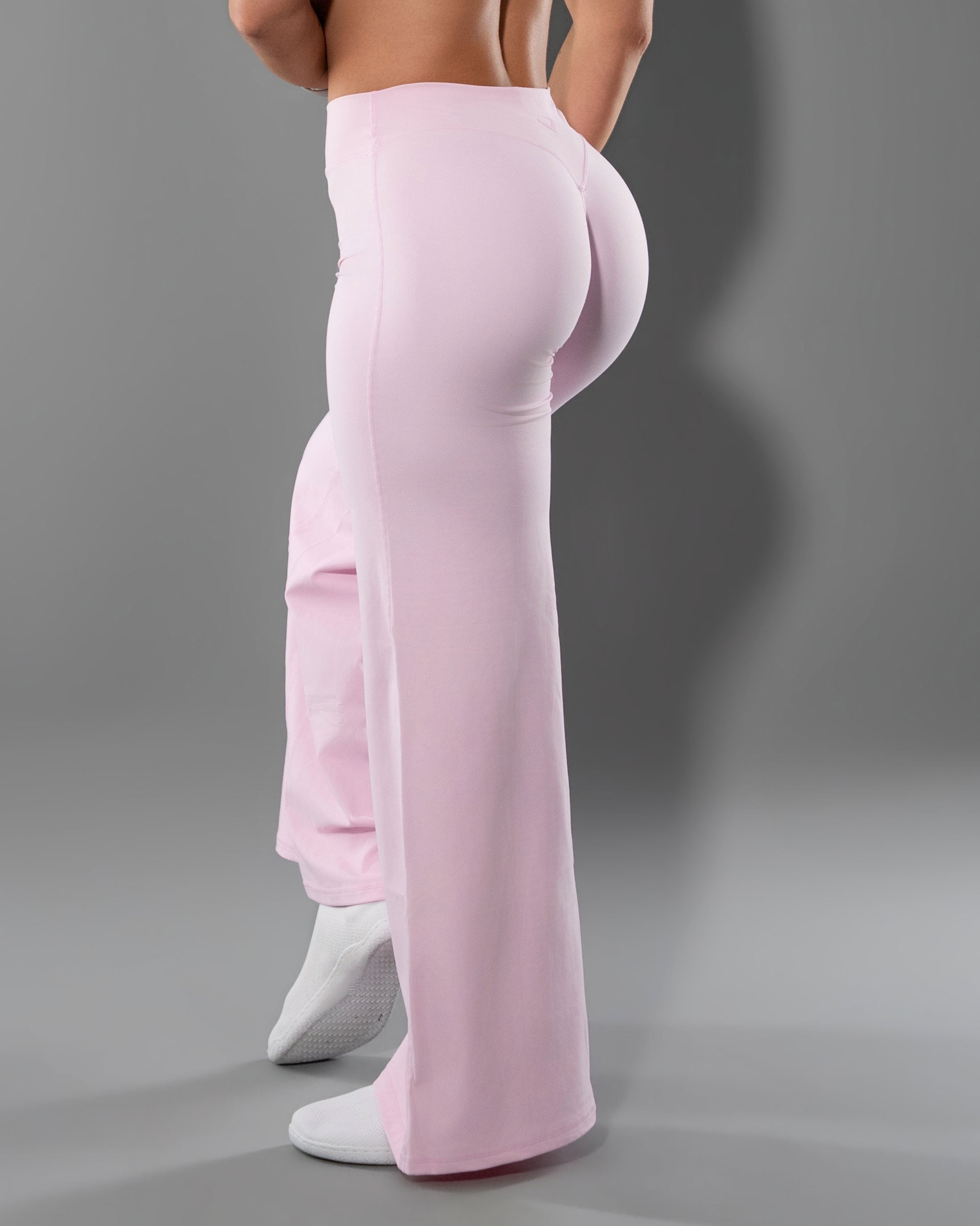 Tempt Flares in Soft Pink from behind, sculpted waistband and floor length flare
