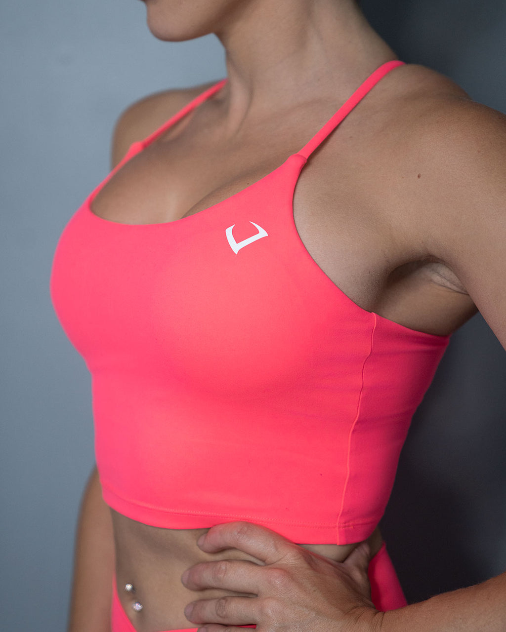 https://violatethedresscode.com/cdn/shop/products/violate-the-dress-code-coral-vice-crop-top-built-in-sports-bra-front.jpg?v=1662144392&width=1024